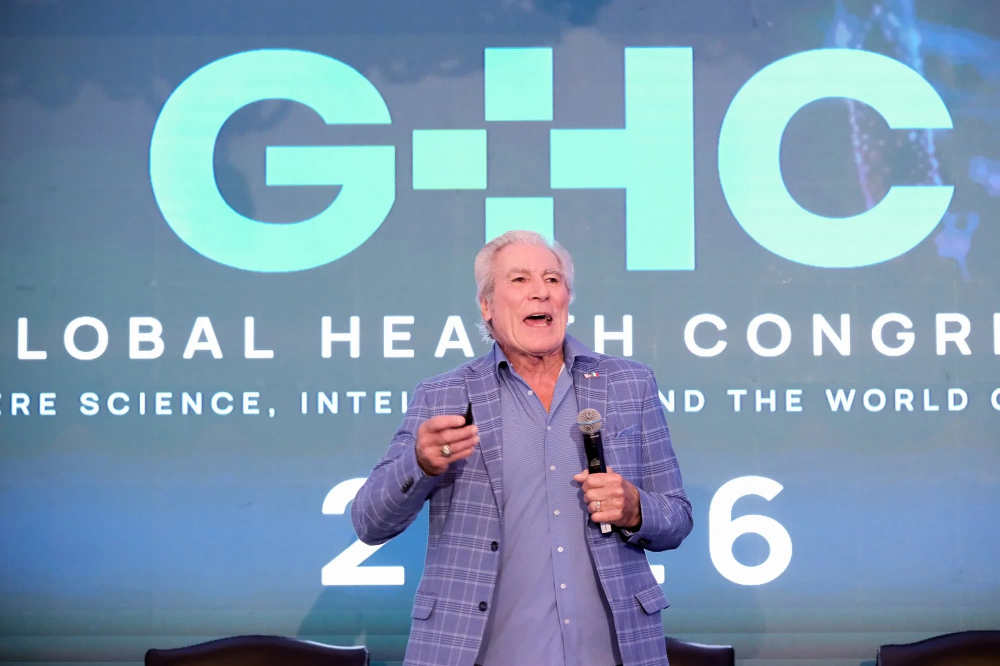 A keynote speaker addressing the Congress on the main stage