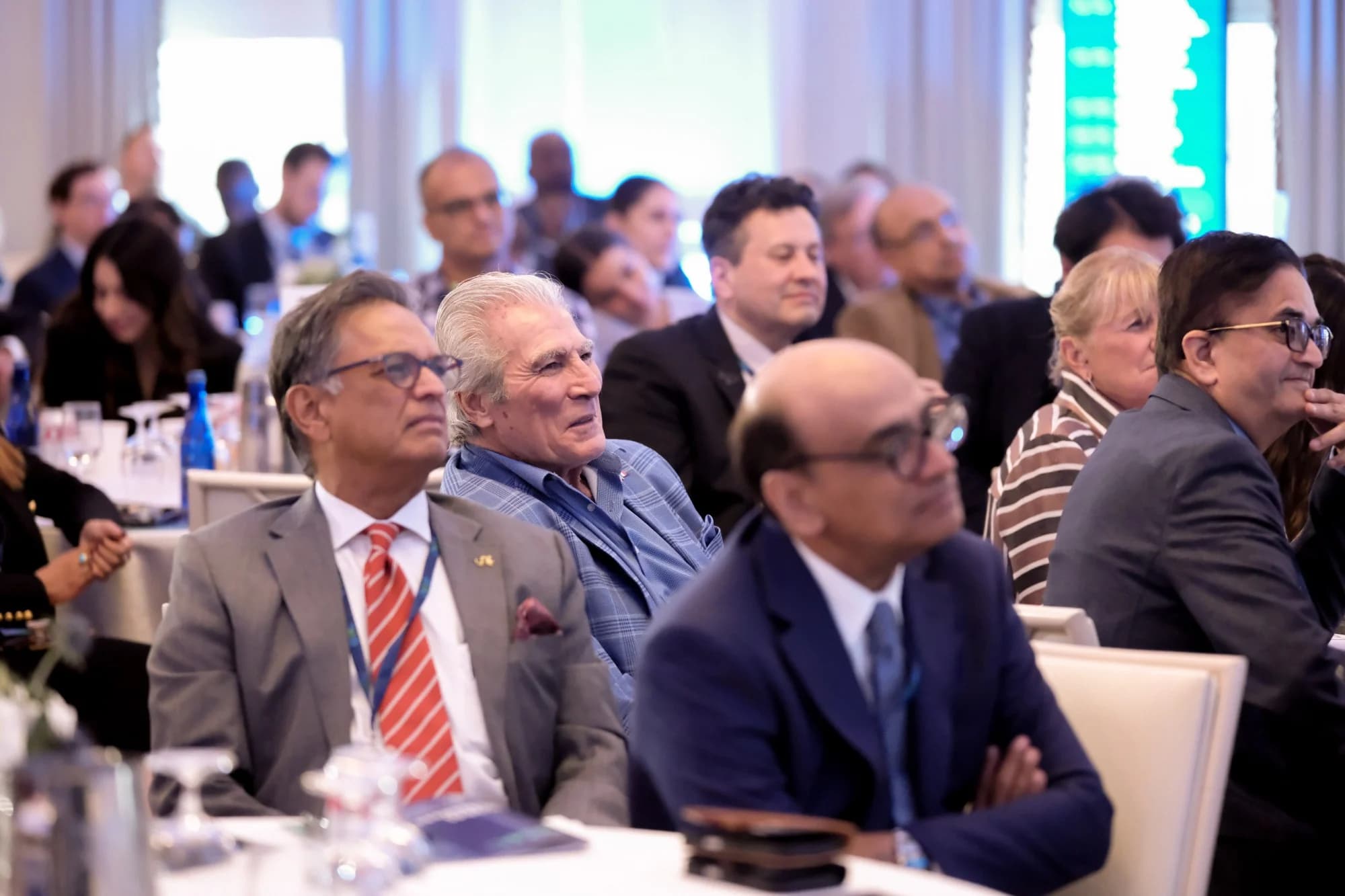 Attendees following a session in the ballroom