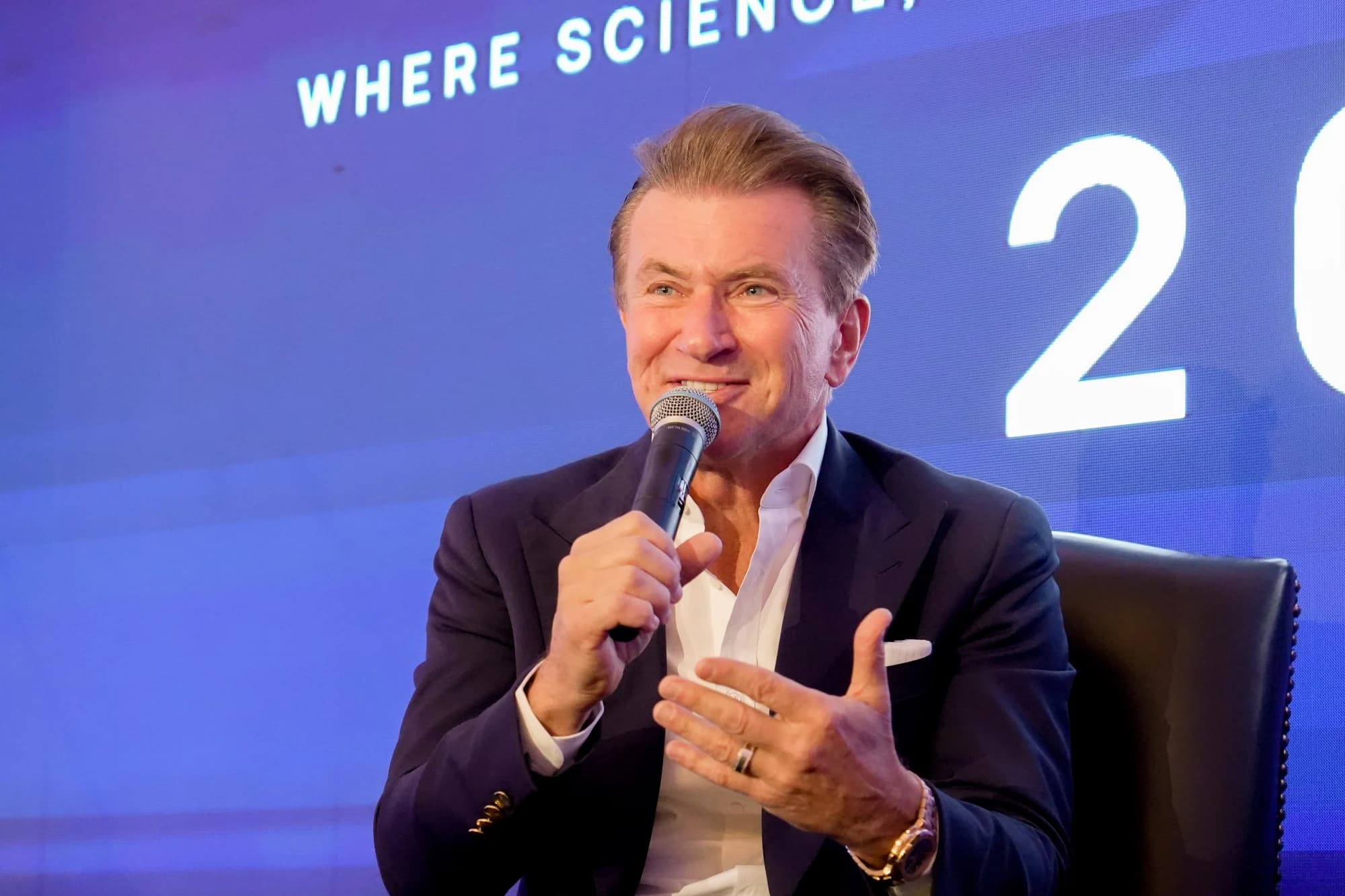 A speaker answering questions on stage
