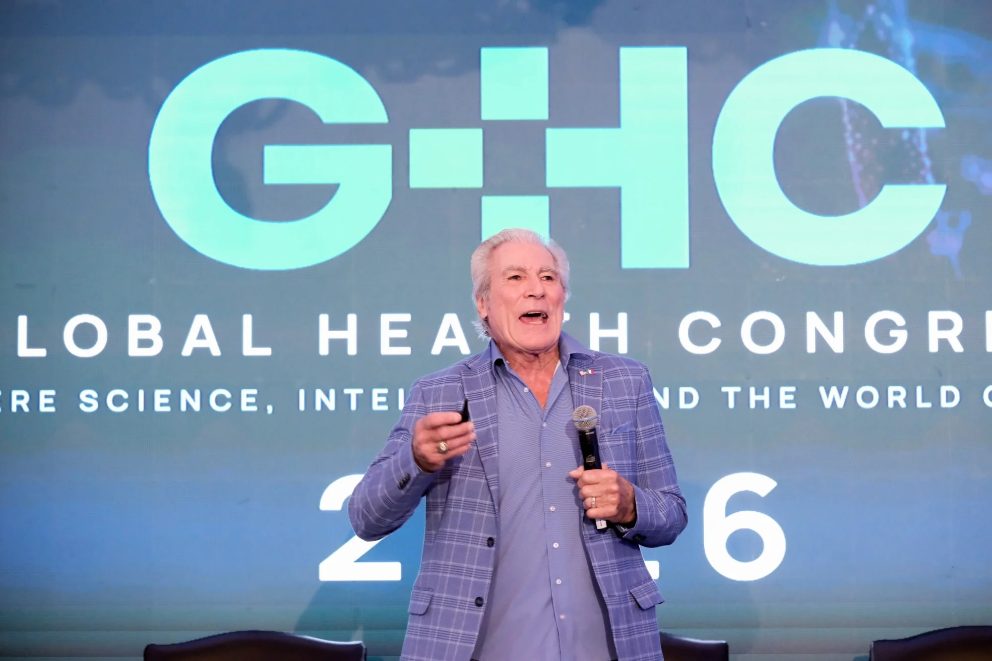 A keynote speaker addressing the Congress on the main stage