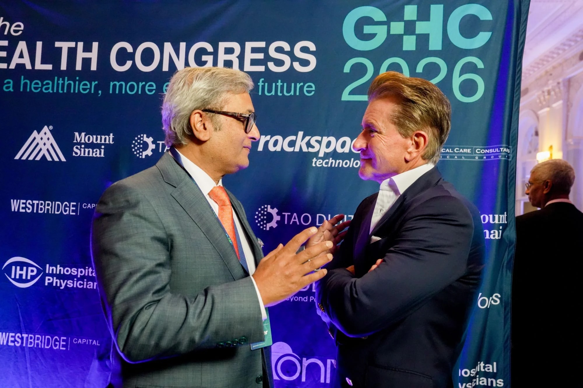 A conversation at the sponsor wall