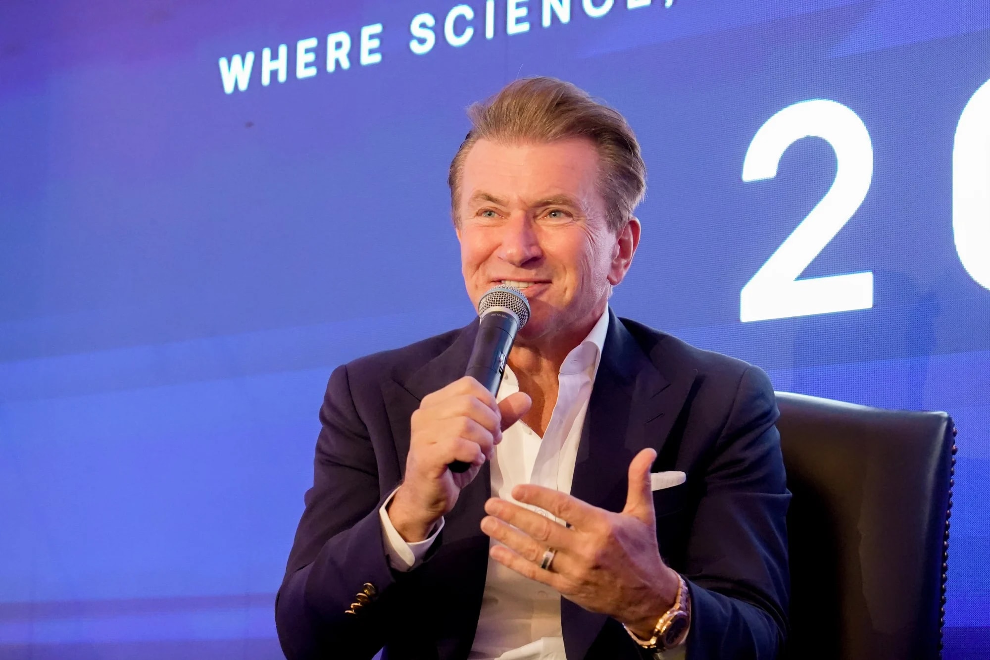 A speaker answering questions on stage